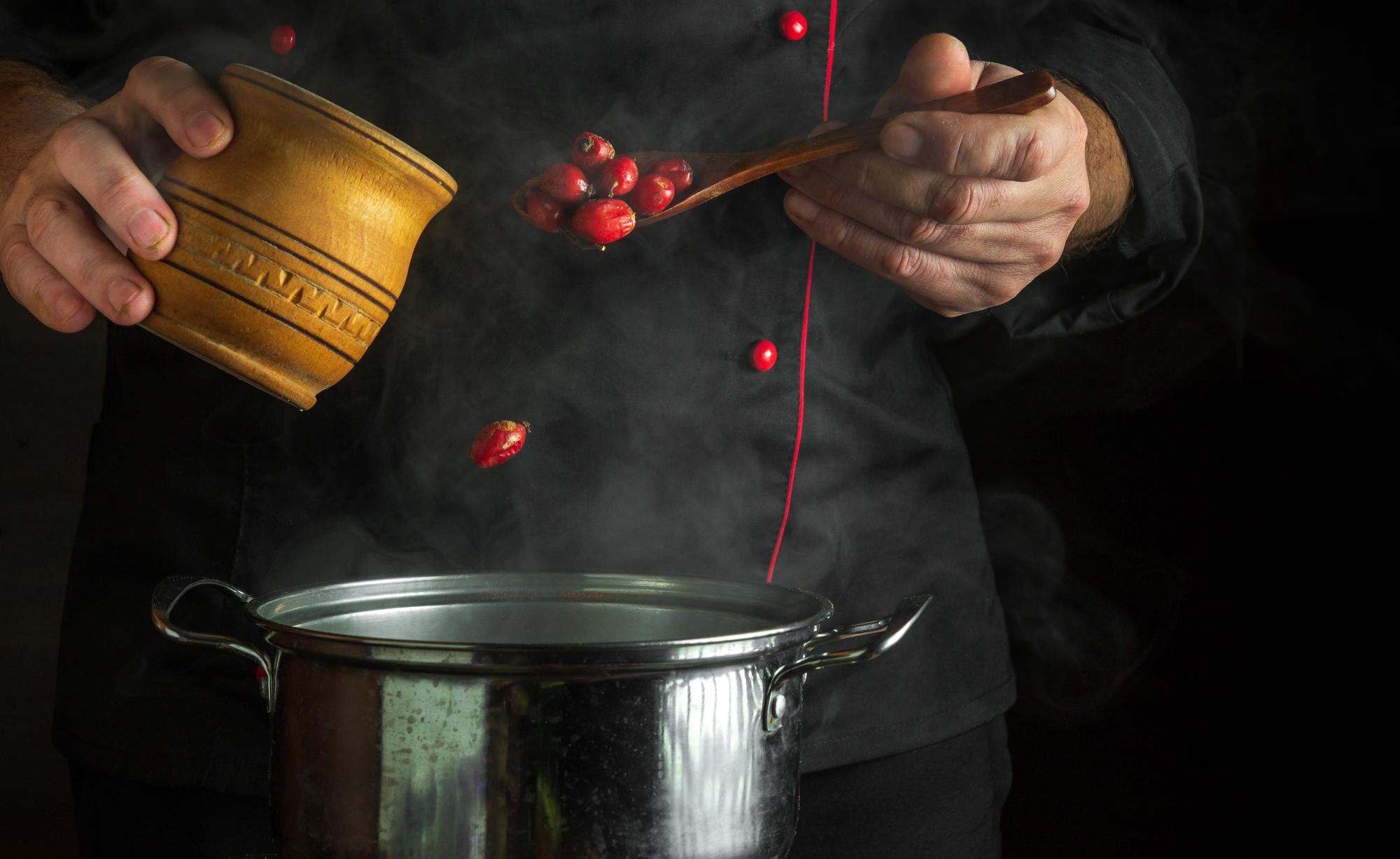 Chef preparing sauce in copper pan